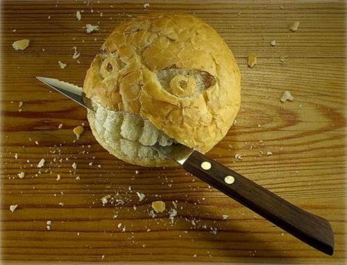 Knife Biting Bread